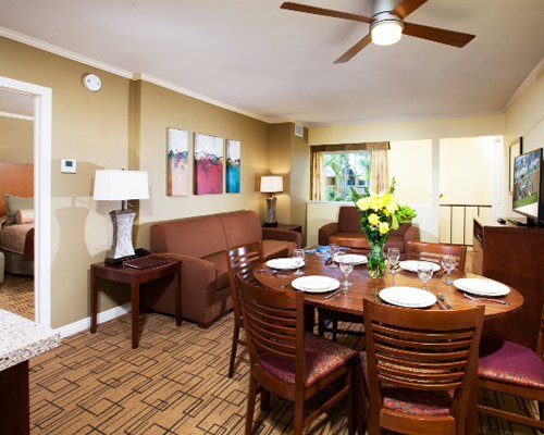 An open plan living and dining area with a television.