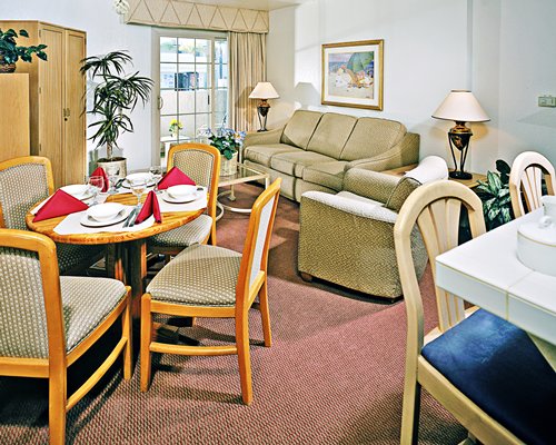 An open plan living and dining area with a patio.