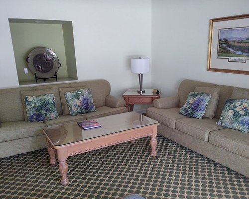 A well furnished living room with a balcony.