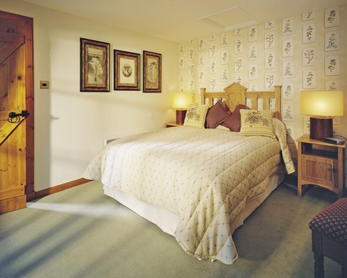 A well furnished bedroom with a king bed.