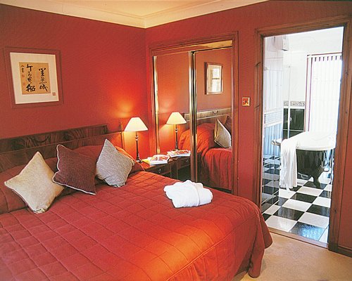 A well furnished bedroom with a king bed.