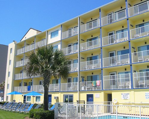 An exterior view of multi story unit balconies.