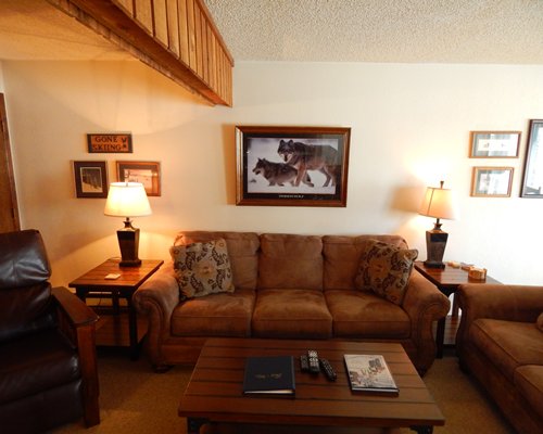 Furnished living room with television and fireplace.