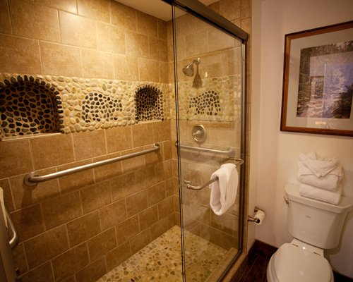 A bathroom with standing shower.