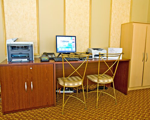 A well furnished room with a computer.