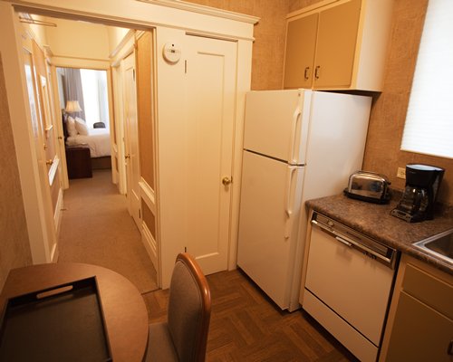 A well equipped kitchen alongside the bedroom.