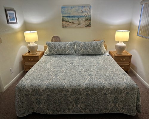 Furnished bedroom with a king bed.