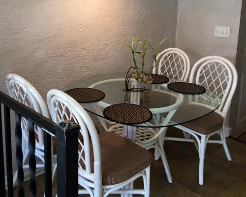 An open plan living room dining room and kitchen with a breakfast bar.