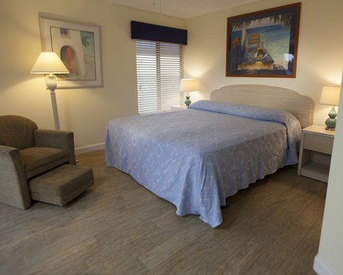 A well furnished bedroom with a queen bed.
