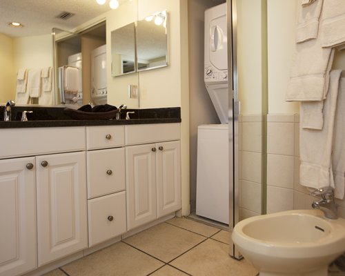 A bathroom with a double sink vanity.