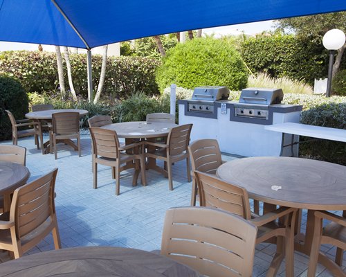 Outdoor restaurant area with barbecue stove.