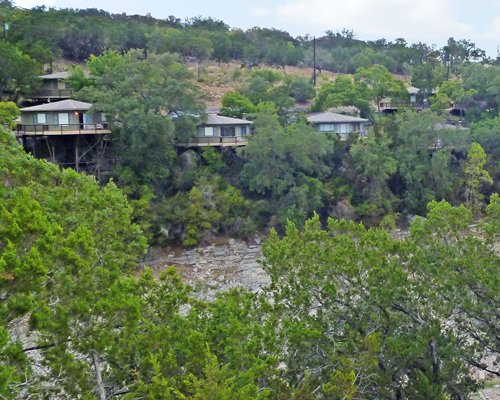 A distant view of the Texas Timeshare resort surrounded by wooded area.