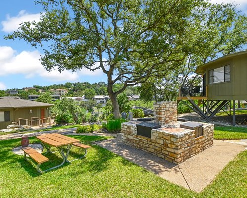 An outdoor view of a wooden fence and hot tub.