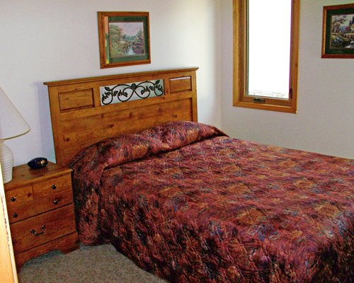 Furnished bedroom with a queen bed.