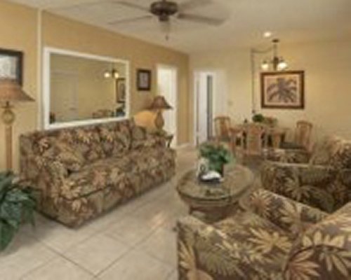 An open plan dining and living area with a television.