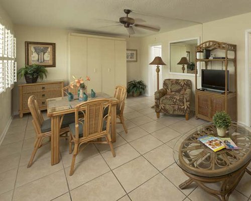 A well furnished living room with a television.
