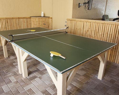 Indoor recreation room with table tennis.