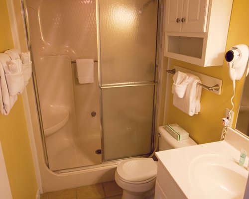 A bathroom with stand up shower.