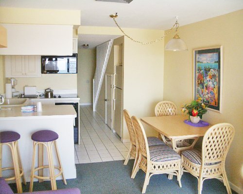 An open plan kitchen with a dining area.