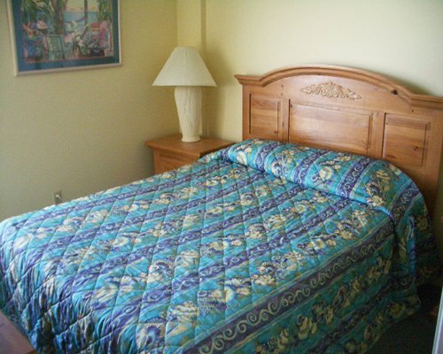 A well furnished bedroom with a queen bed.