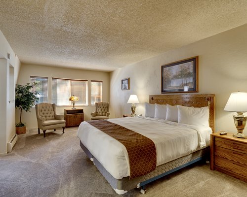 A well furnished bedroom with two twin beds.