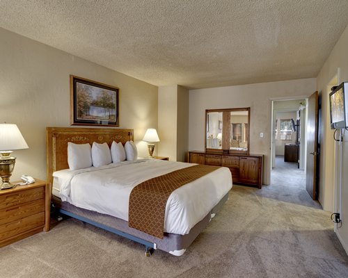 A well furnished bedroom with a king bed.