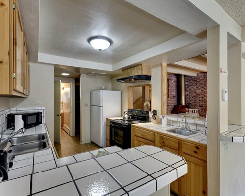 A bathroom with a shower and a double sink vanity.
