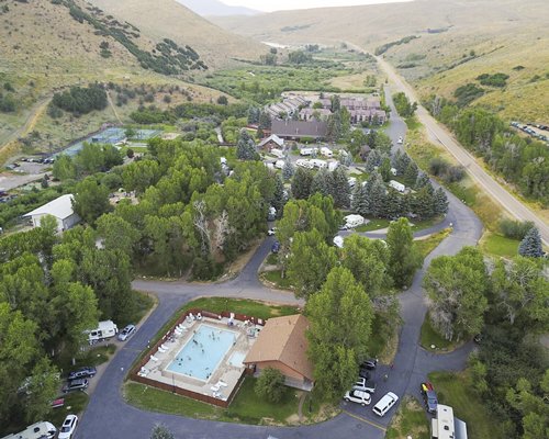 An aerial view of East Canyon Resort surrounded by a wooded area.