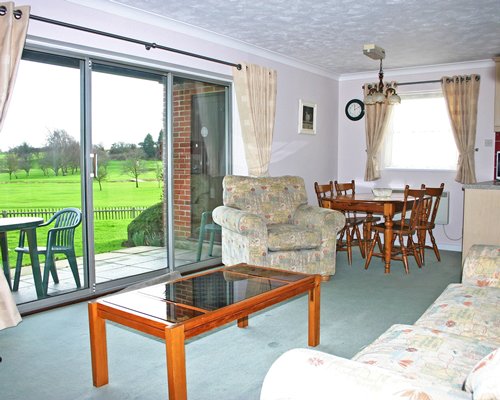 An open plan living and dining area with a patio.