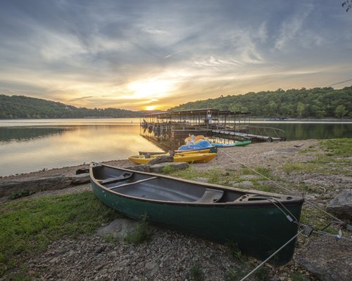 A canoe on a lake at dusk.