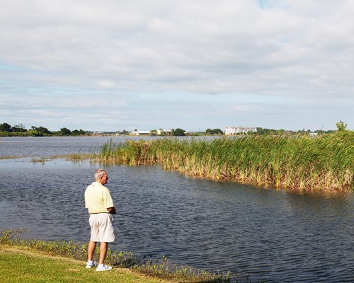 A man fishing at the lake.