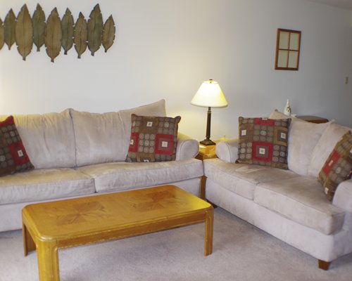 A well furnished living room with a pull out sofa.