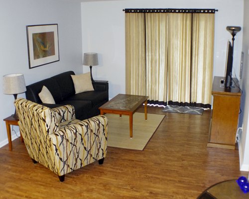 A well furnished living room with a double pull out sofa.