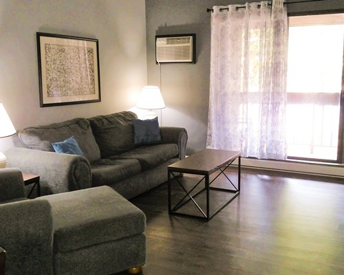 A well furnished bedroom with a queen bed.
