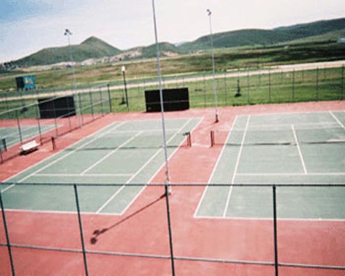 View of two outdoor tennis court.