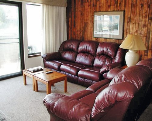 A well furnished living room with pullout sofa and an outside view.