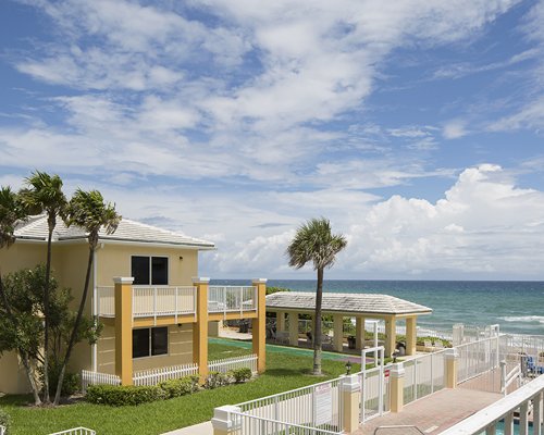 Scenic exterior view of multiple units alongside the beach.
