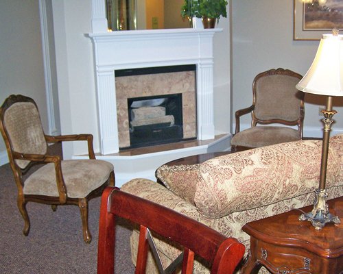 A large well furnished living area with a fireplace.