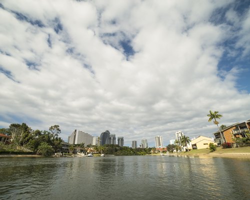 A panoramic view of several buildings from a canal.