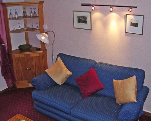 A well furnished living room with pullout sofa and an outside view.