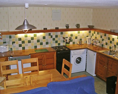 A well furnished bed room with two twin beds and outside view.