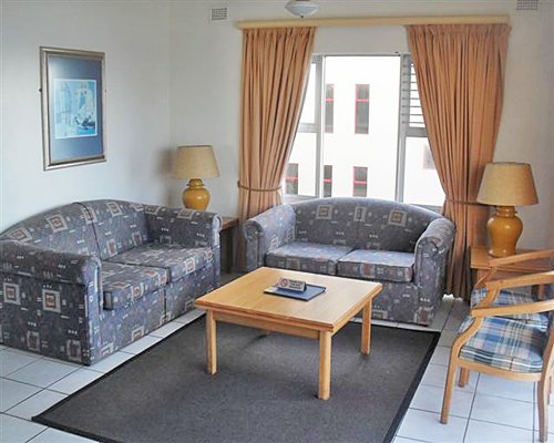 Furnished living room with two sofas.