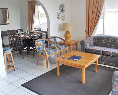 An open plan living and dining area with an outside view.