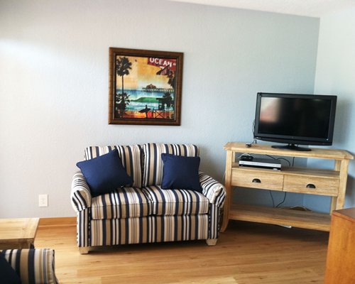 A well furnished living area with a television.