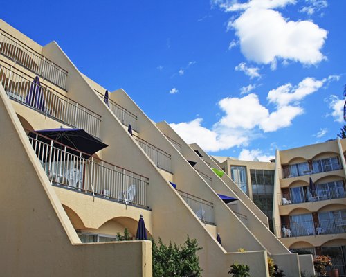 A ground view of multi story balconies.