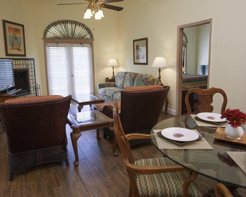 An open plan living and dining area with a television.