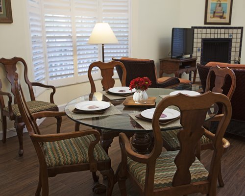 Living room with television and dining area.