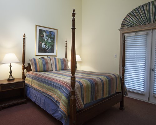 A well furnished bedroom with an outside view.