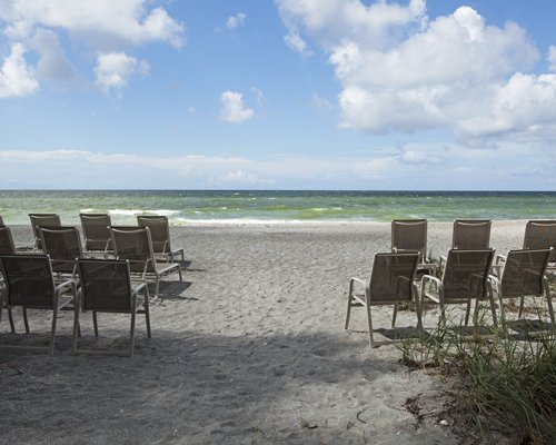 Lounge chairs facing the beach.