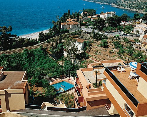 An aerial view of the ocean with buildings and landscaping.